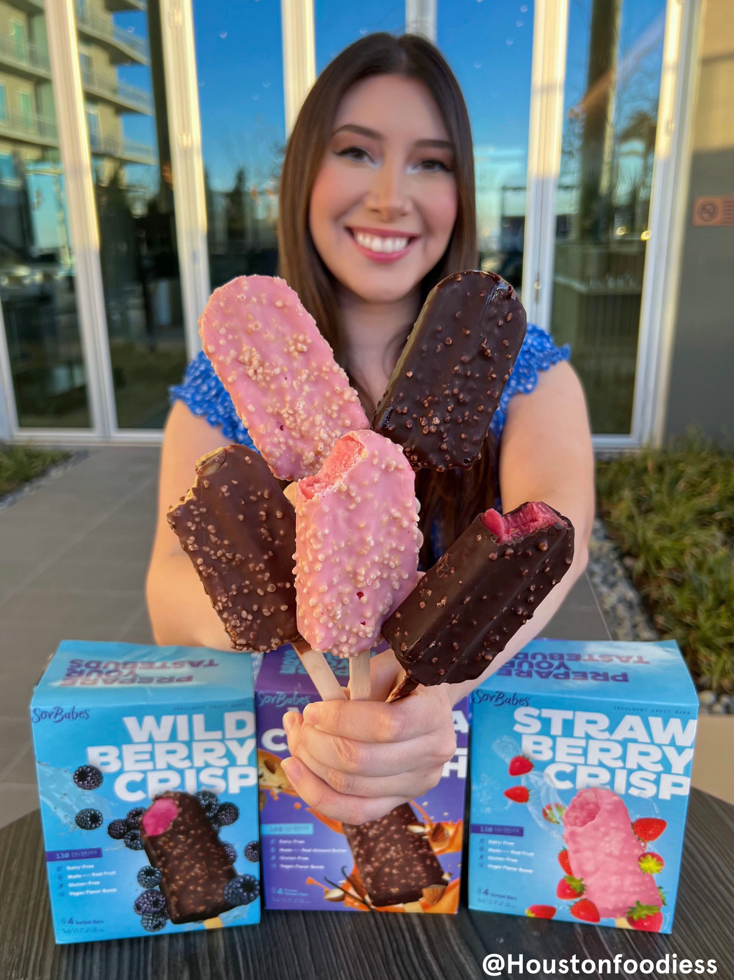 
                    
                      Holding SorBabes frozen fruit bars
                    
                  